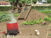 On the farm, water is boiled to sanitize the soil in which coffee seeds will be planted