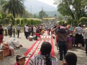 An alfombra is under construction in front of the mission