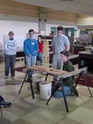 Michael, Tony, and Daniel testing a spaghetti tower for a contest